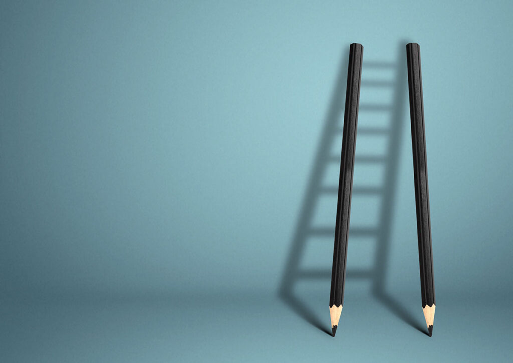 two pencils forming a ladder shadow